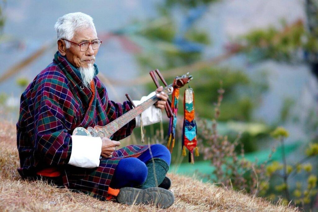 Old musician performing a song with the classical instrument